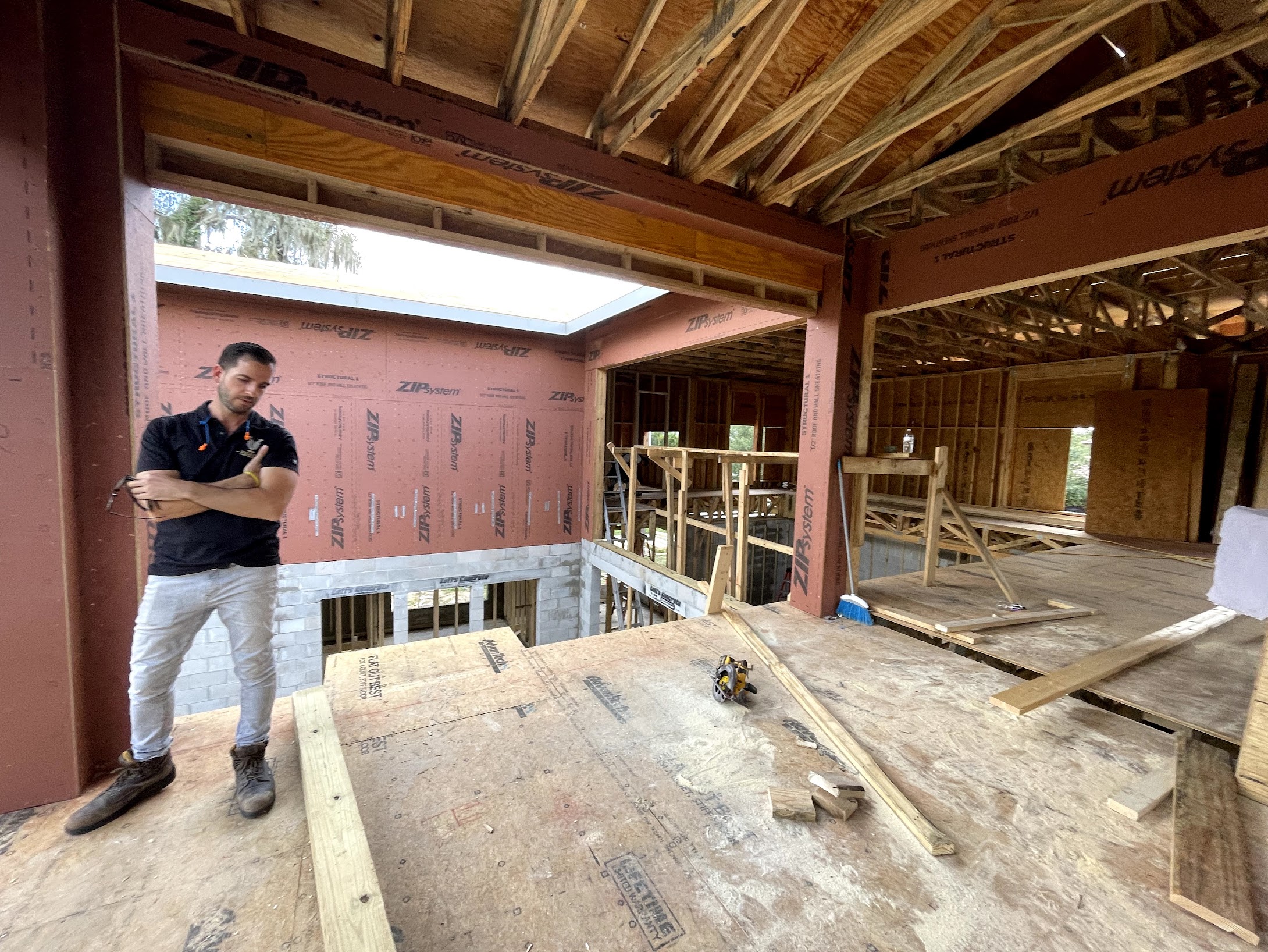 Christopher inspecting framing during construction